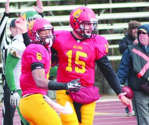 Jason Vander Laan (right) and receiver Shakur Sanders celebrate one of Vander Laan's three rushing touchdowns in route to a 35-17 victory over the Northern Michigan Wildcats while earning a share of the GLIAC title in the process.