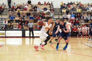 Freshman guard Drew Cushingberry makes a move at the top of the key. Cushingberry has provided a scoring touch off the bench this season.