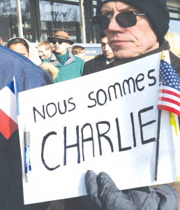 People gather for a silent march in Washington, D.C. on Sunday, Jan. 11, 2015, to honor those who died during three days of attacks in France.