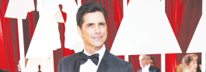 John Stamos plays the beloved Uncle Jesse in Full House and is directing the new show, Fuller House.