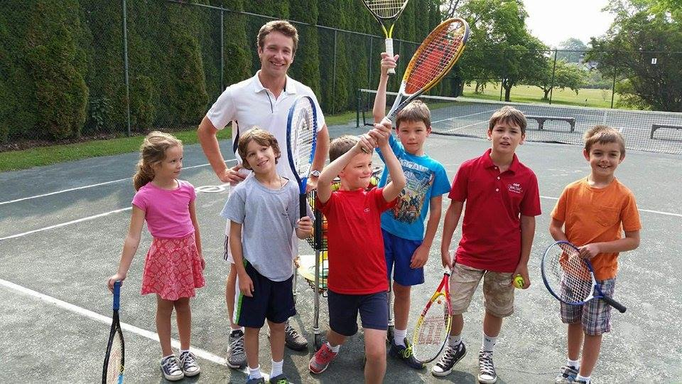 Cole Heule smiles through his internship with his tennis students on Mackinac Island.