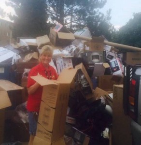 Ferris custodians Diane MaGuire (pictured) and Pam Marvel break down a mountain of recyclable cardboard near Miller Hall.