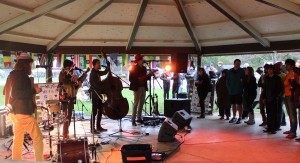 Photo by: Devin Anderson | News Editor A roar of booming beats from Music on the Muskegon’s drum circle came to a halt for Ann Arbor’s Appleseed Collective to take the stage in Hemlock Park.