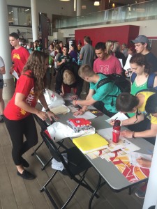 News Services employee Natalie Bycraft hands out Ferris merchandise at Bulldog Bonanza.