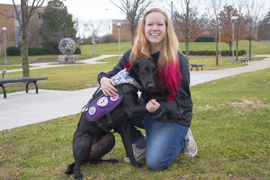 Mary Schuler poses with Esther, who helps Schuler detect drops in her blood sugar. Esther has helped Schuler through four seizures this year.