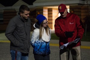 Keegan Murphy and Madison Hawley plan a walking route with vice president for administration and finance Jerry Scoby.