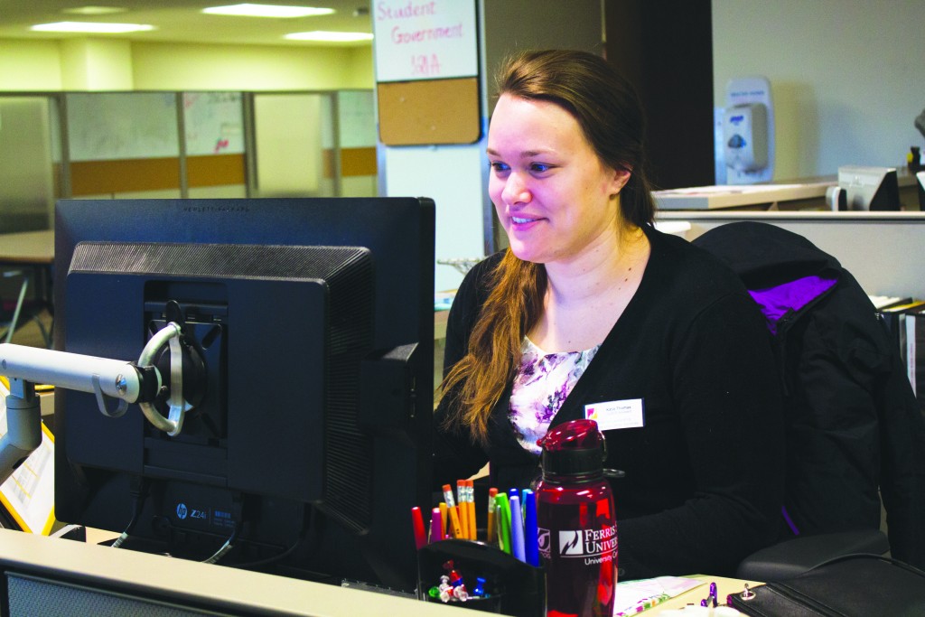 Former Ferris student Katie Douglas-Smith can be found at her desk in the CLACS office, answering questions and assisting students.