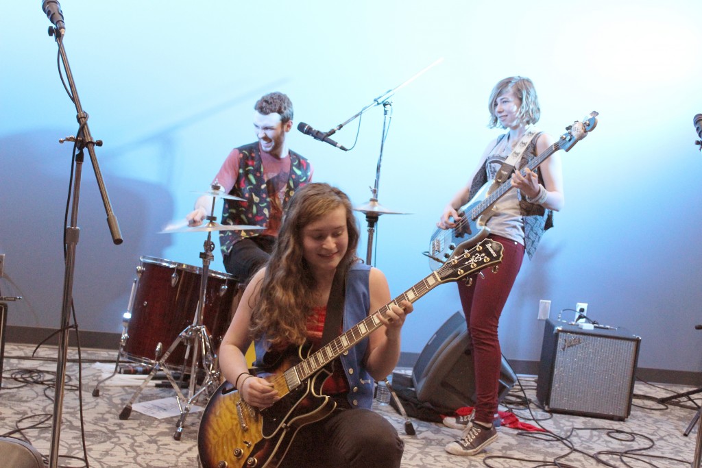 The Traverse City folk rock group The Accidentals, composed of Michael Dause (left), Katie Larson (center) and Savannah Buist (right). performed for over 200 people in the College of Business.