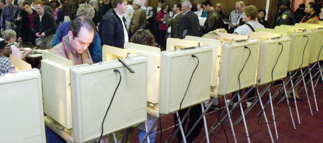 Citizens cast their votes at private polling booths. Michigan’s caucus is scheduled for March 8.