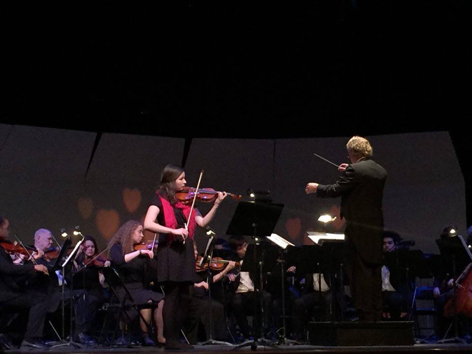 On Sunday, Feb. 14, Williams Auditorium hosted Ferris’ annual Valentines Day concert. The show included performances by the FSU West Central Concert Band, the FSU Symphony Band and the FSU West Central Chamber Orchestra. Shown below is Ferris graphic design freshman Sarah Massey, one of two soloists featured during the concert. She performed the “Meditation” violin solo from the French opera, Thaïs, by Jules Massenet.