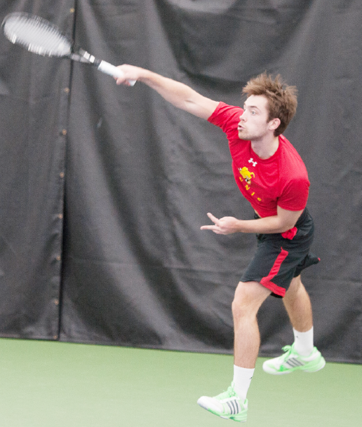 Ferris junior Robert Camplin, a Walpole, England native blasts a serve in a match earlier this season in Big Rapids.