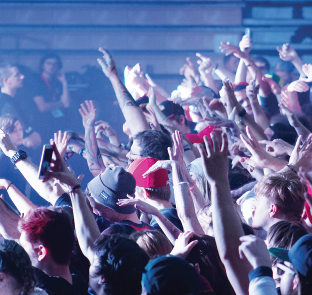 Ferris studetns raise their arms and move along to the beat as Zeds Dead takes the stage as the headliner at the sixth annual Turn Up the Good event, hosted by the Music Industry Management Association.