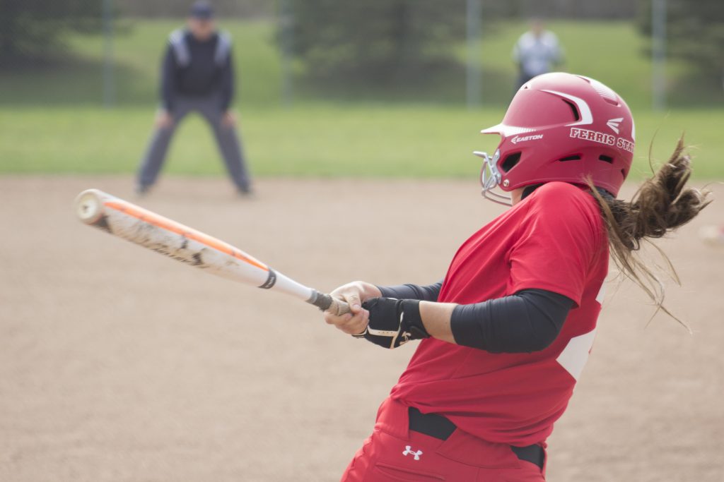 Senior second baseman Michelle Tononi takes a swing after walking to the plate to the tune of her walk-up song, "Dirty Pop" by NSYNC.