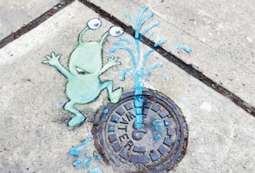 Some whimsical street art by artist David Zinn. He specializes in street art that gives the impression of standing, sitting or action using the corners of buildings, nooks and other urban features.