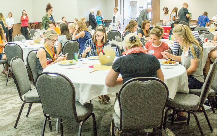 Students and faculty attending the Welcome Women in Engineering Technology event take the opportunity to network and eat dinner in the University Center.