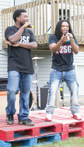 Twenty and PMoe on stage during the Sundown show at Oakwood Apartments