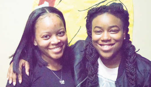 You Beautiful Black Woman president Taylor Williamson (left) and vice president Todd’Nita Taylor (right) host their vision board event in the common area of Merrill and Travis halls.