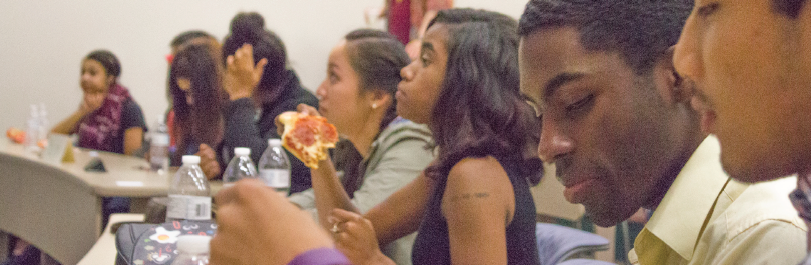 Students attending the NAACP Multicultural Explosion enjoy pizza and beverages as they discuss questions to explore different aspects of the diverse population on campus.