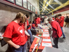 Silent auction items sit on display on a table.