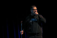 Erik Griffin delivering his stand-up routine at Williams Auditorium