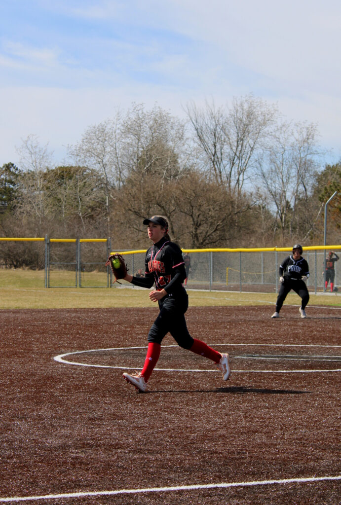 Evelyn Blood holds a runner at third.